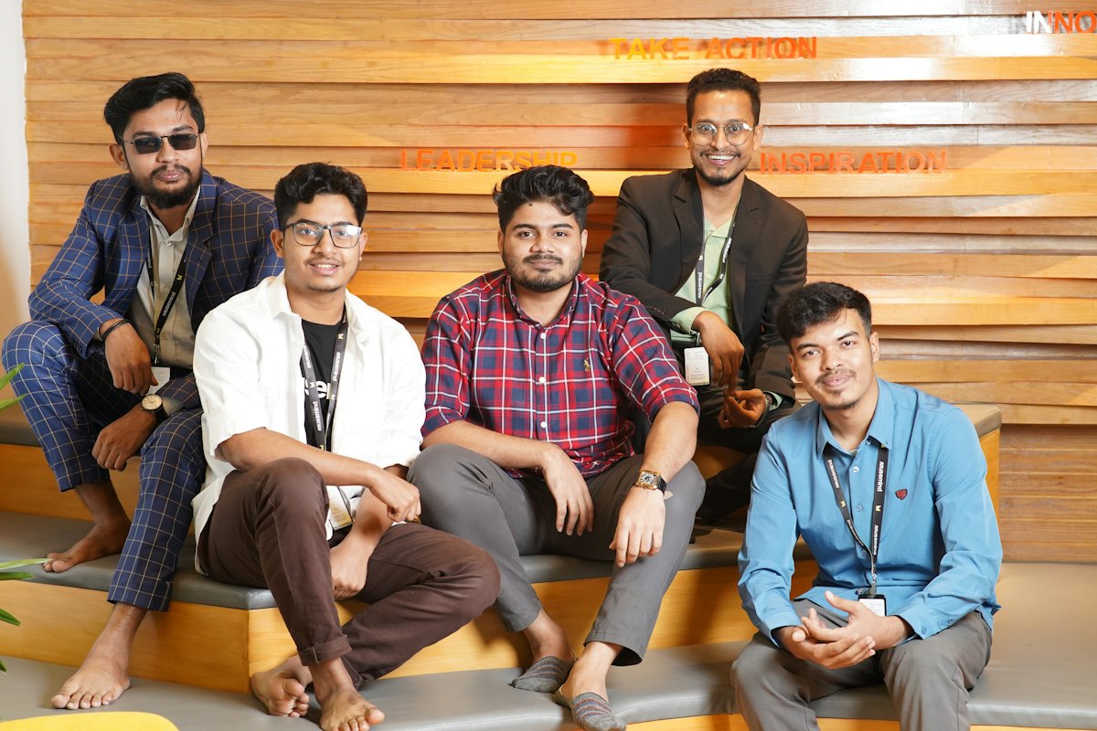 A small team working together around a laptop